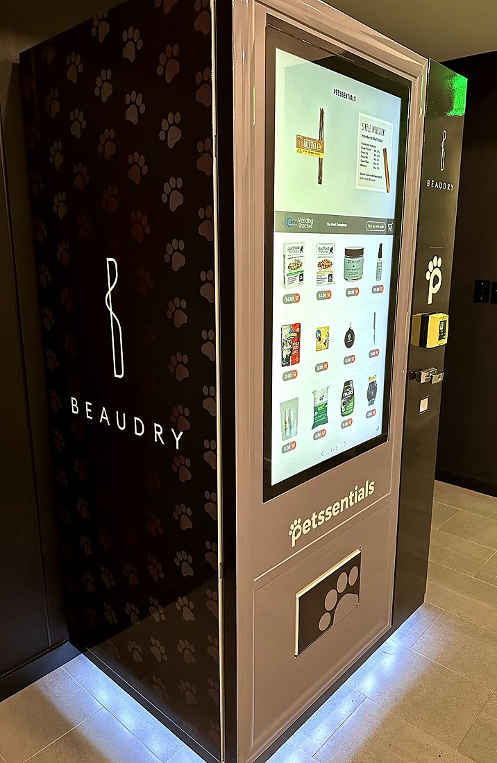 Petssentials Pet Hub at The Beaudry, with a touchscreen front and a black paw-print wrap